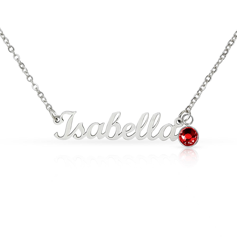 Silver-tone necklace with the sample name Isabella and a red birthstone charm on a white background.