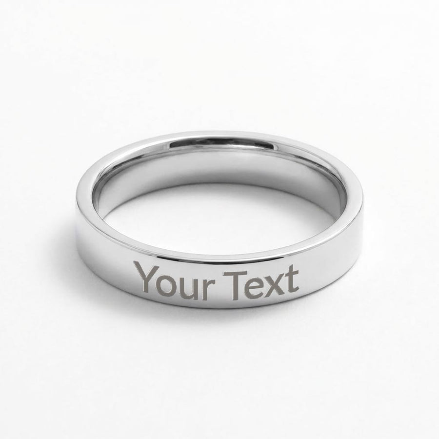 Polished silver-tone ring on a white background, engraved with the sample text 'Your Text'.