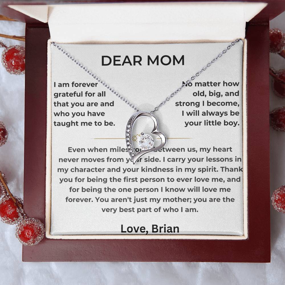 Silver heart necklace and Dear Mom card displayed inside a red presentation box