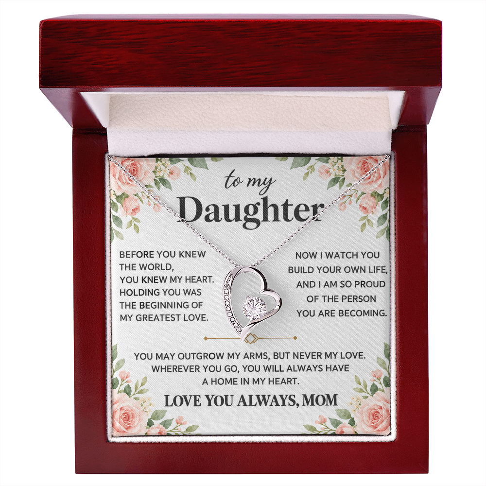 Heart pendant necklace displayed in an open red presentation box with the Daughter message card.