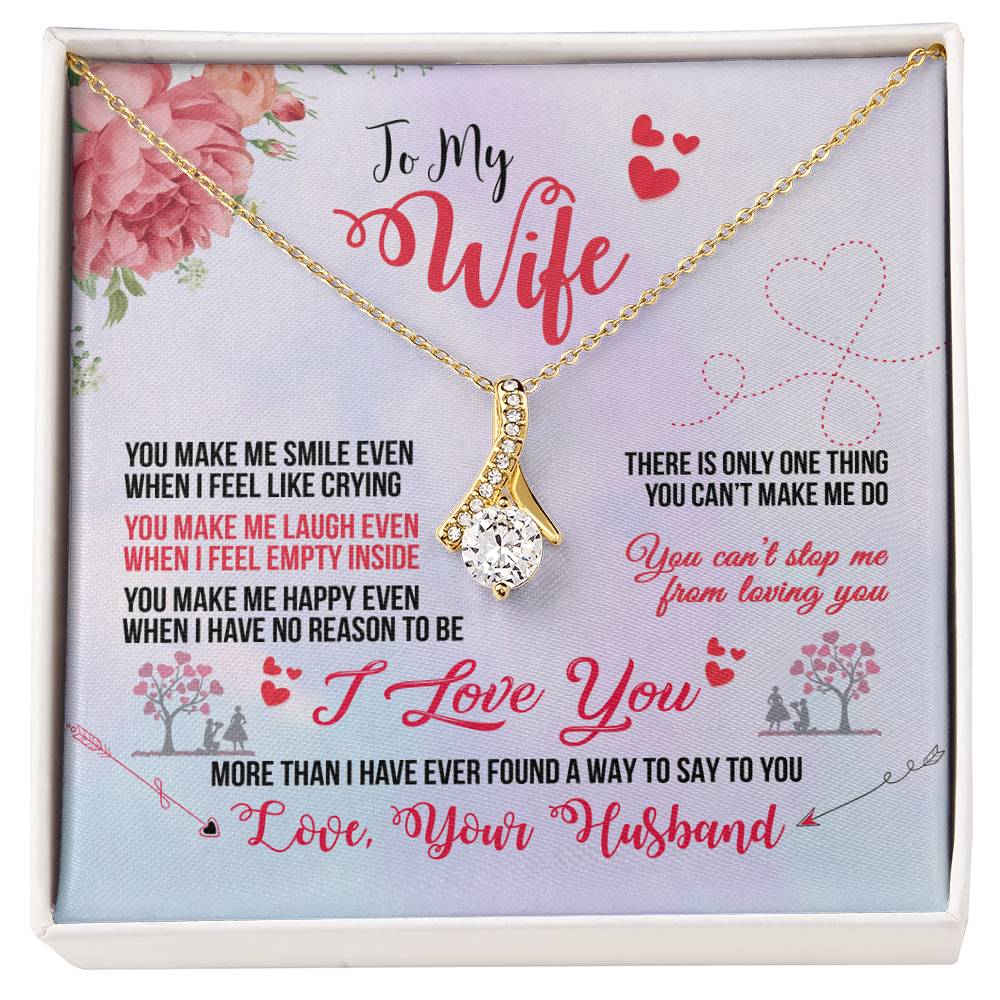 Gold-tone ribbon pendant necklace displayed on a To My Wife message card