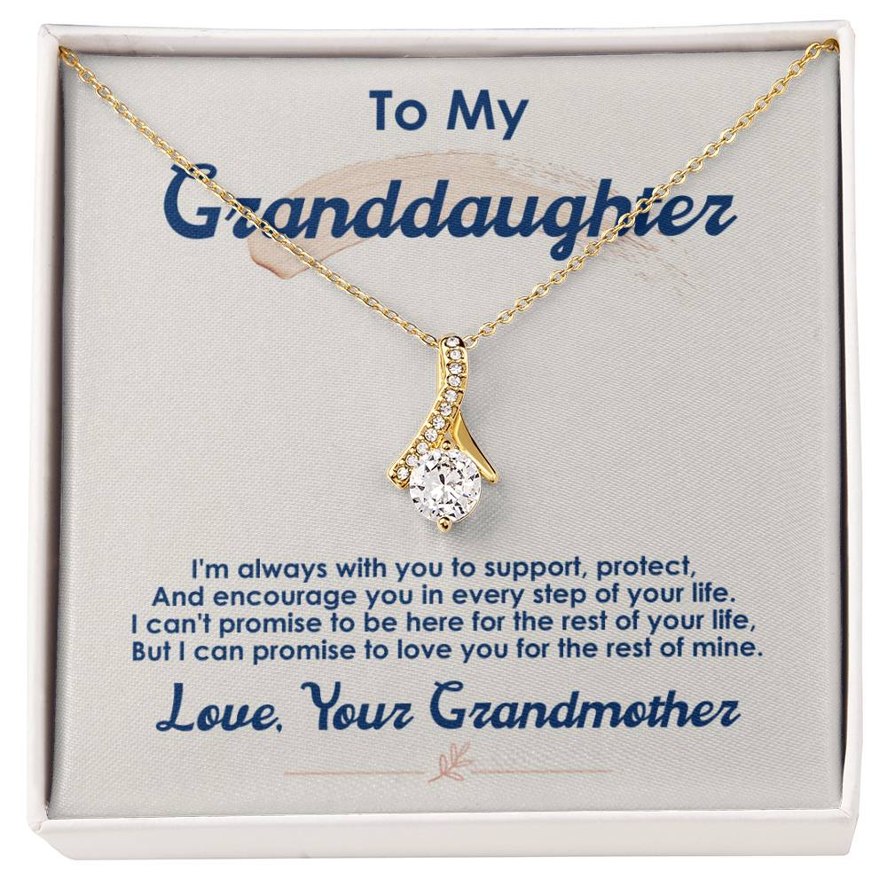Gold-tone pendant necklace displayed on a message card addressed to a granddaughter.