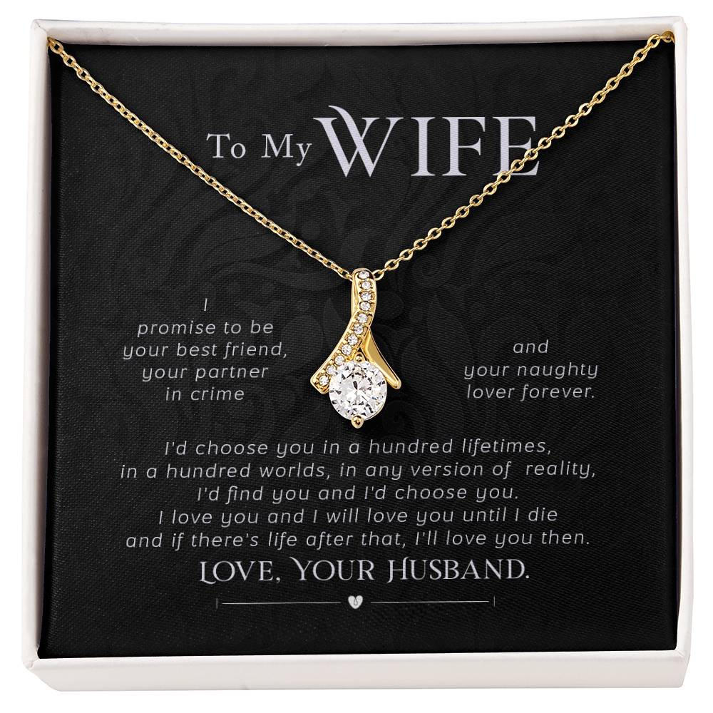 Gold-tone ribbon pendant necklace displayed on a black message card for a wife.