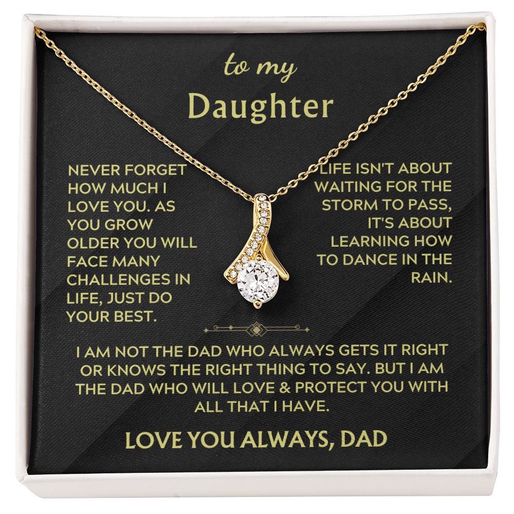 Gold ribbon pendant necklace displayed on a black daughter message card