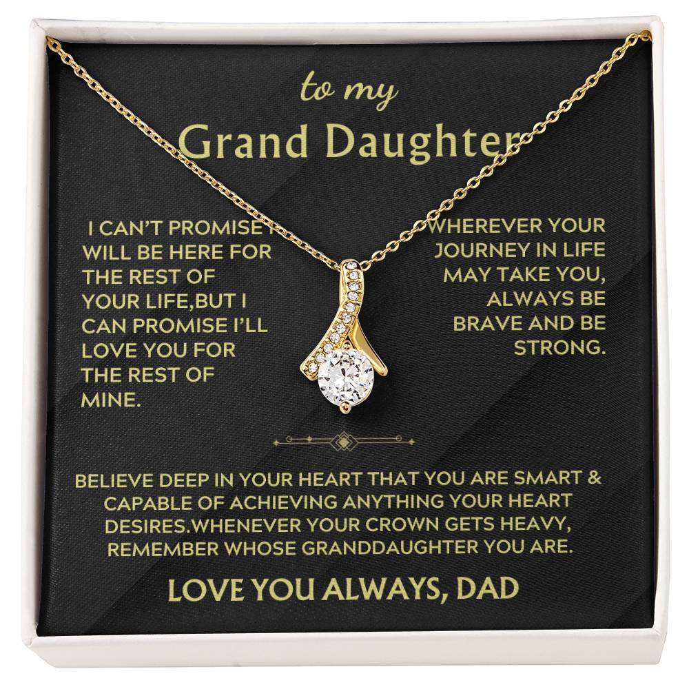 Gold ribbon pendant necklace displayed on a black message card for a granddaughter.