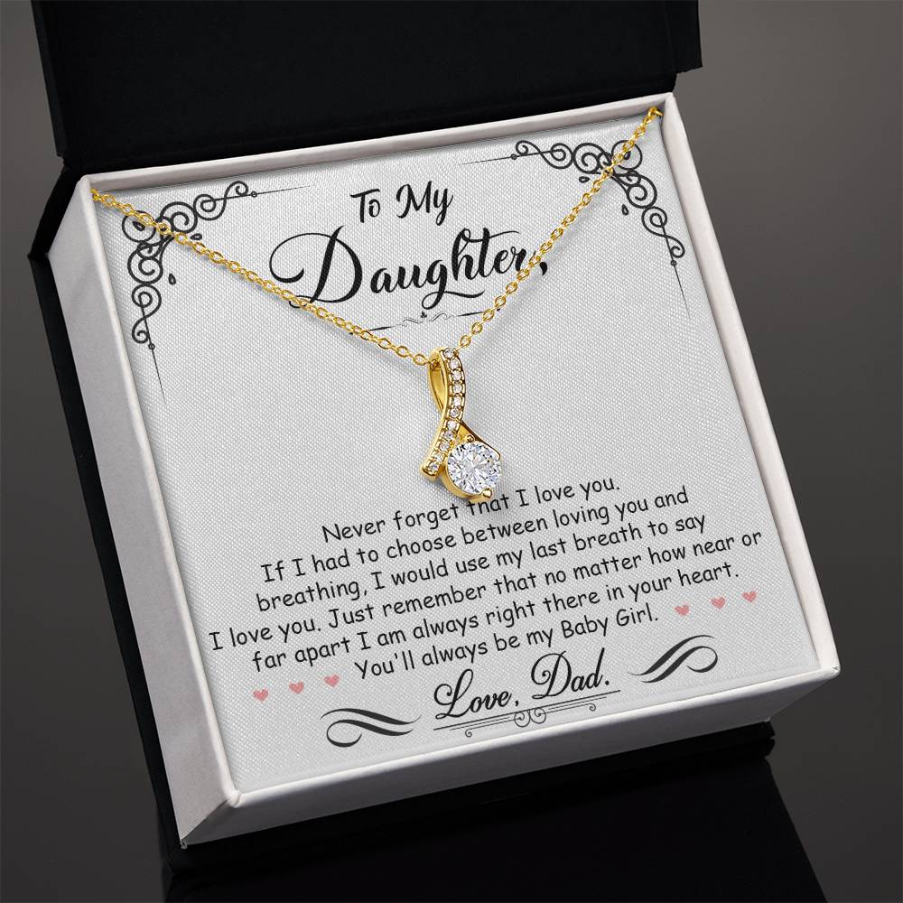 Gold daughter message necklace arranged in an open black presentation box