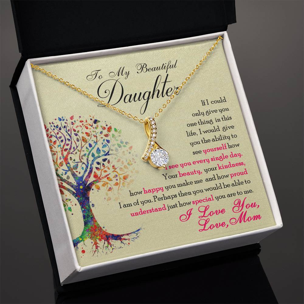 Gold-tone necklace and daughter message card shown inside an open black jewellery box.