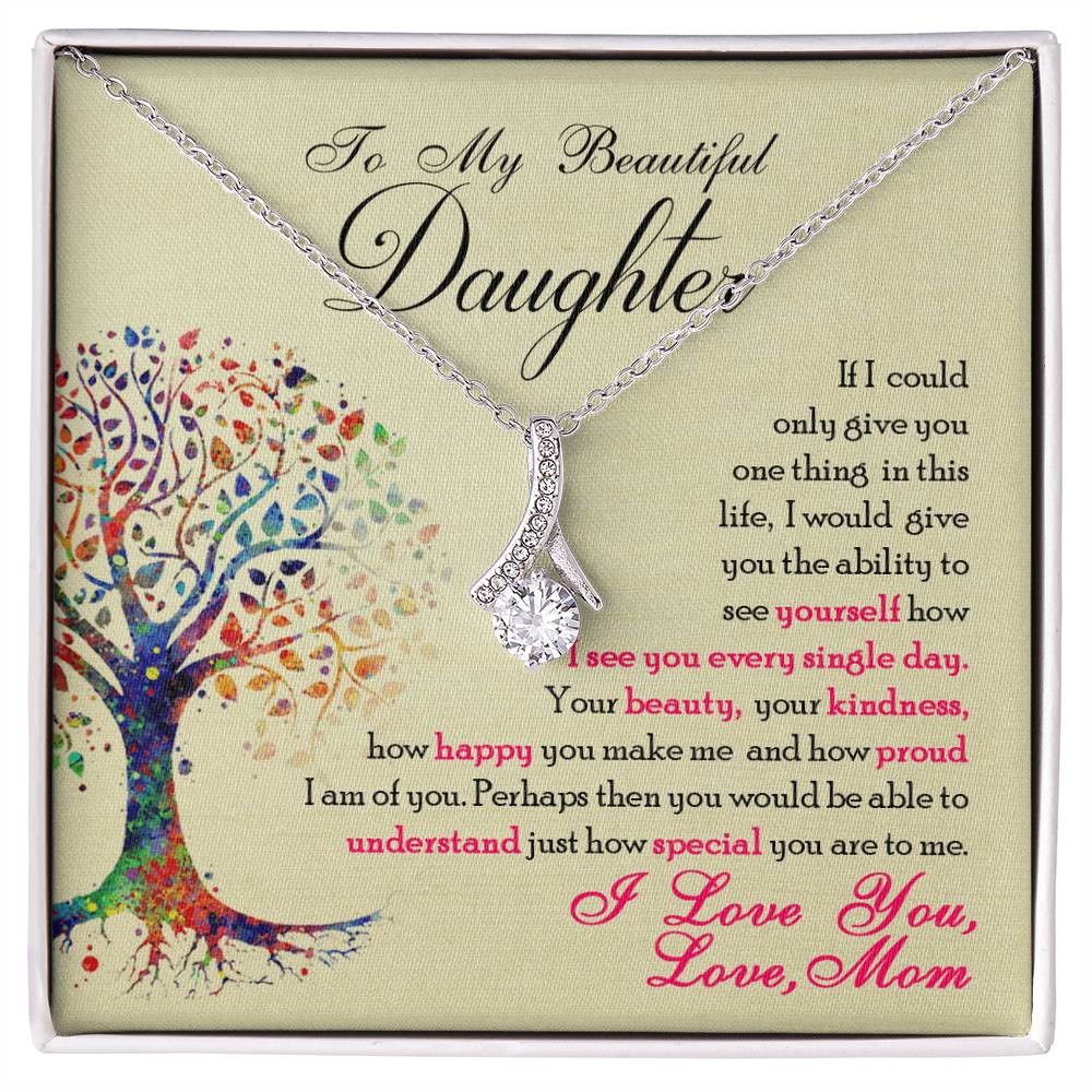 Silver-tone ribbon pendant necklace displayed over a daughter message card.
