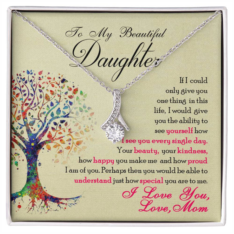 Silver-tone ribbon pendant necklace displayed over a daughter message card.
