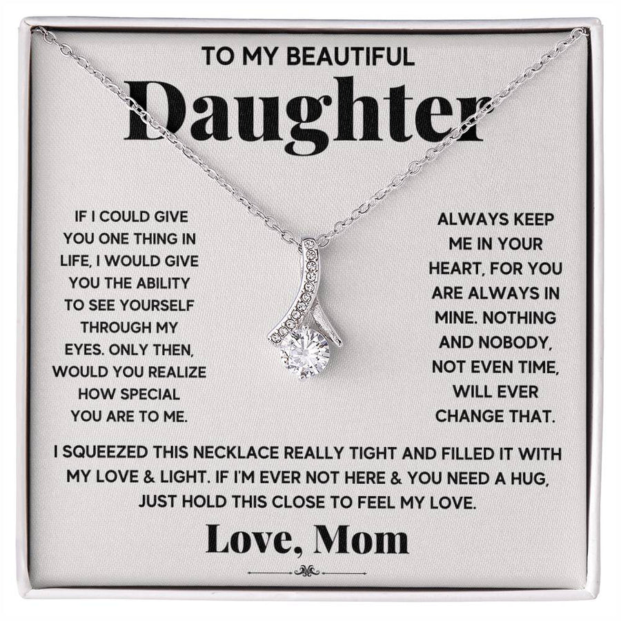 Silver ribbon pendant necklace displayed on a printed message card for a daughter