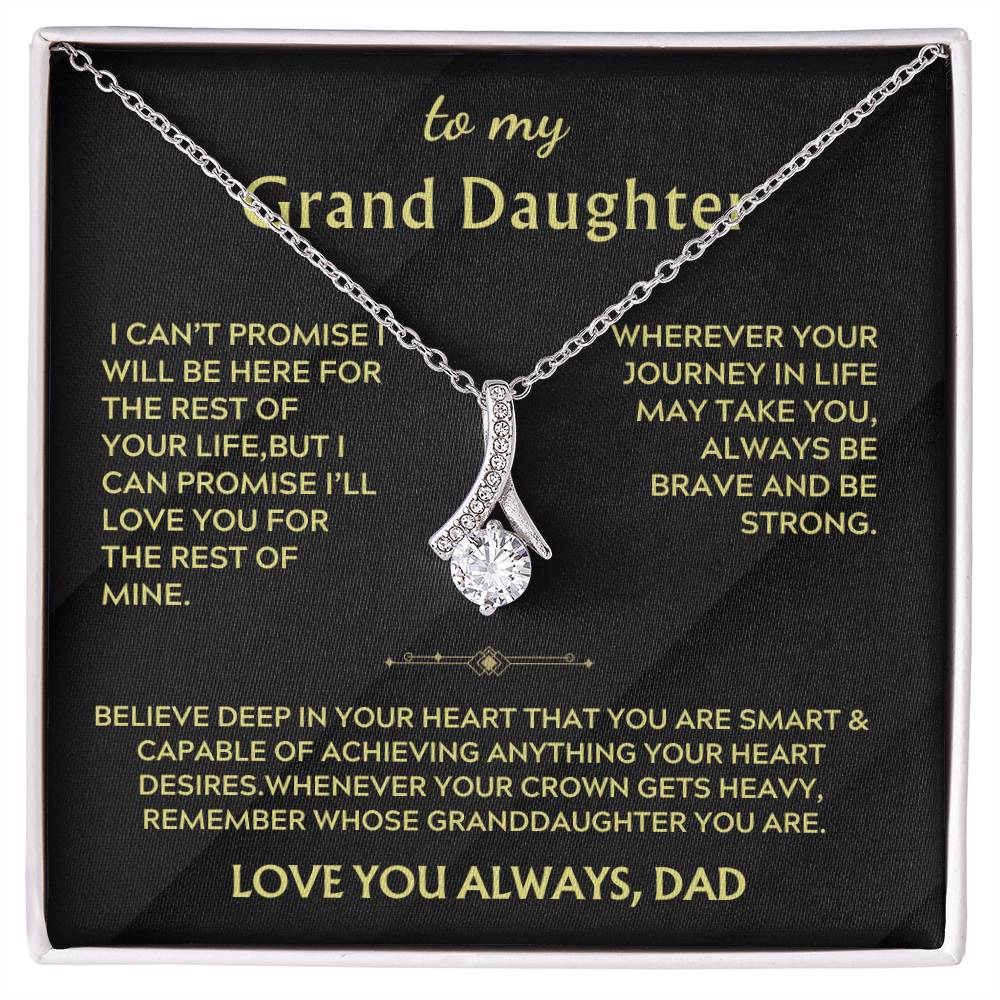 Silver ribbon pendant necklace displayed on a black message card for a granddaughter.