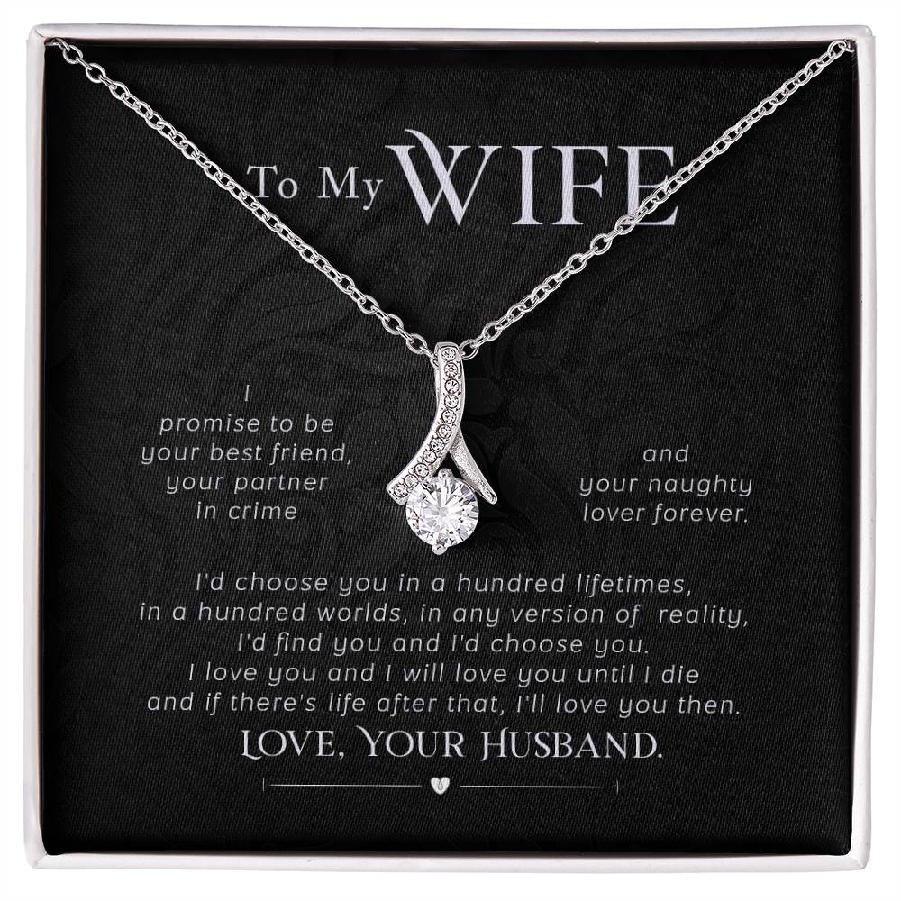 Silver-tone ribbon pendant necklace displayed on a black message card for a wife.