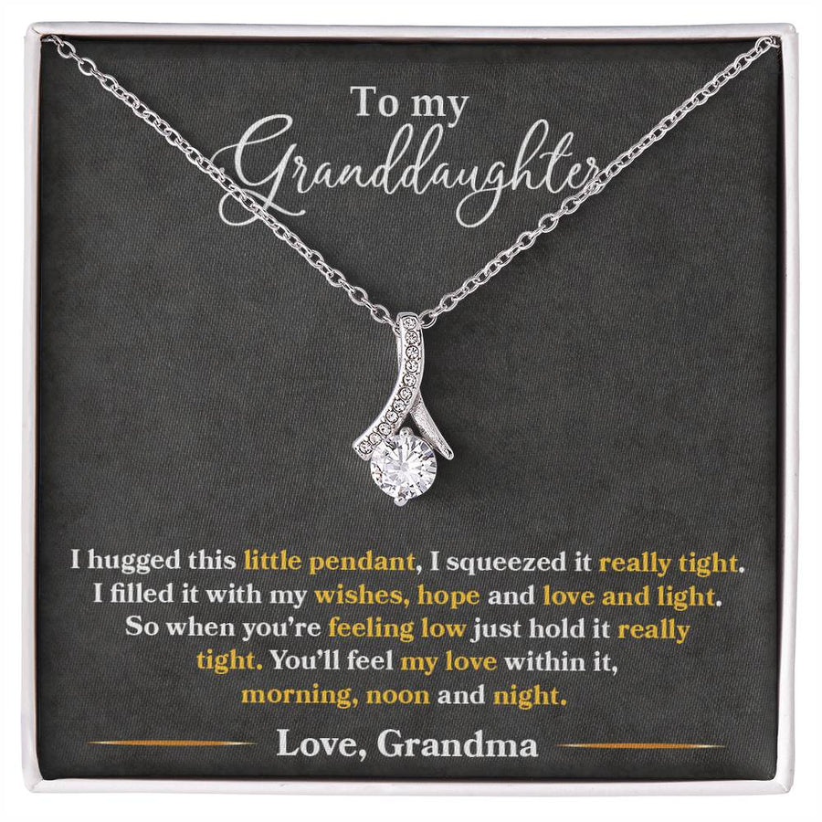 Silver pendant necklace displayed on a message card for a granddaughter
