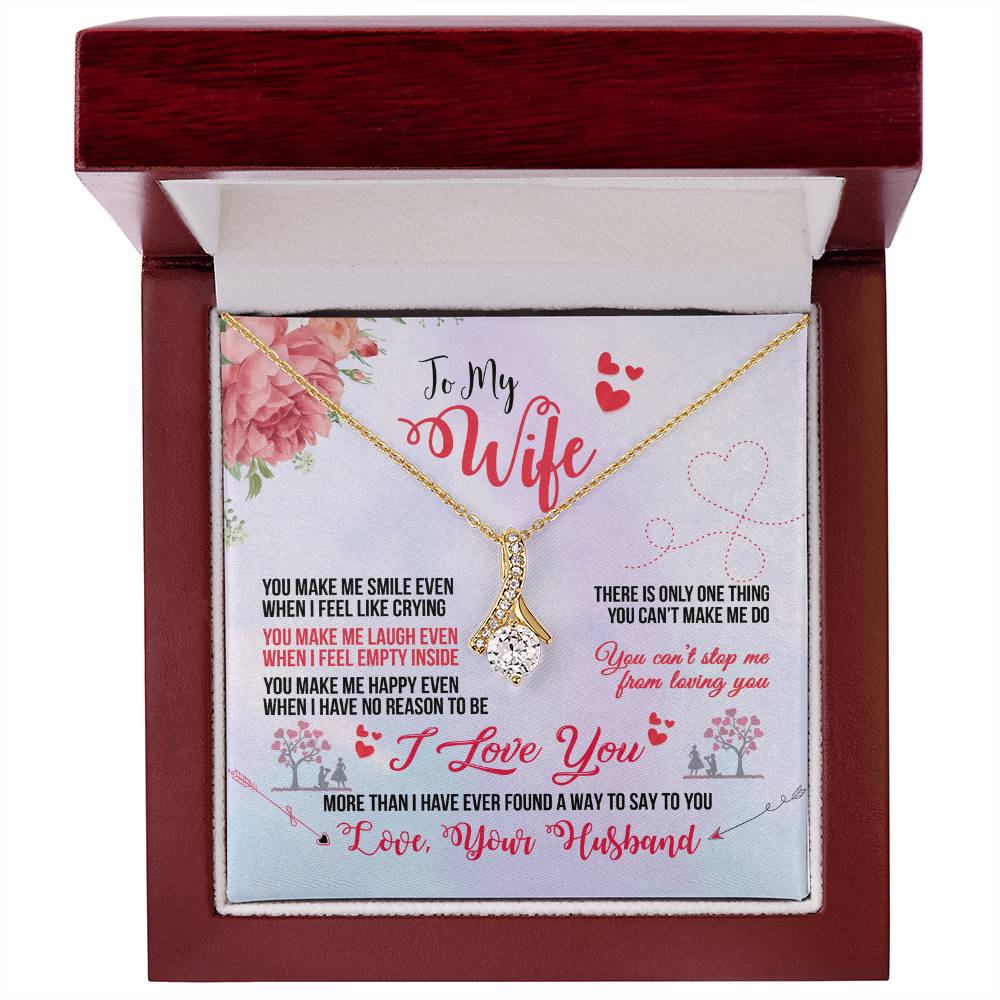Front view of a mahogany presentation box holding the To My Wife necklace and card
