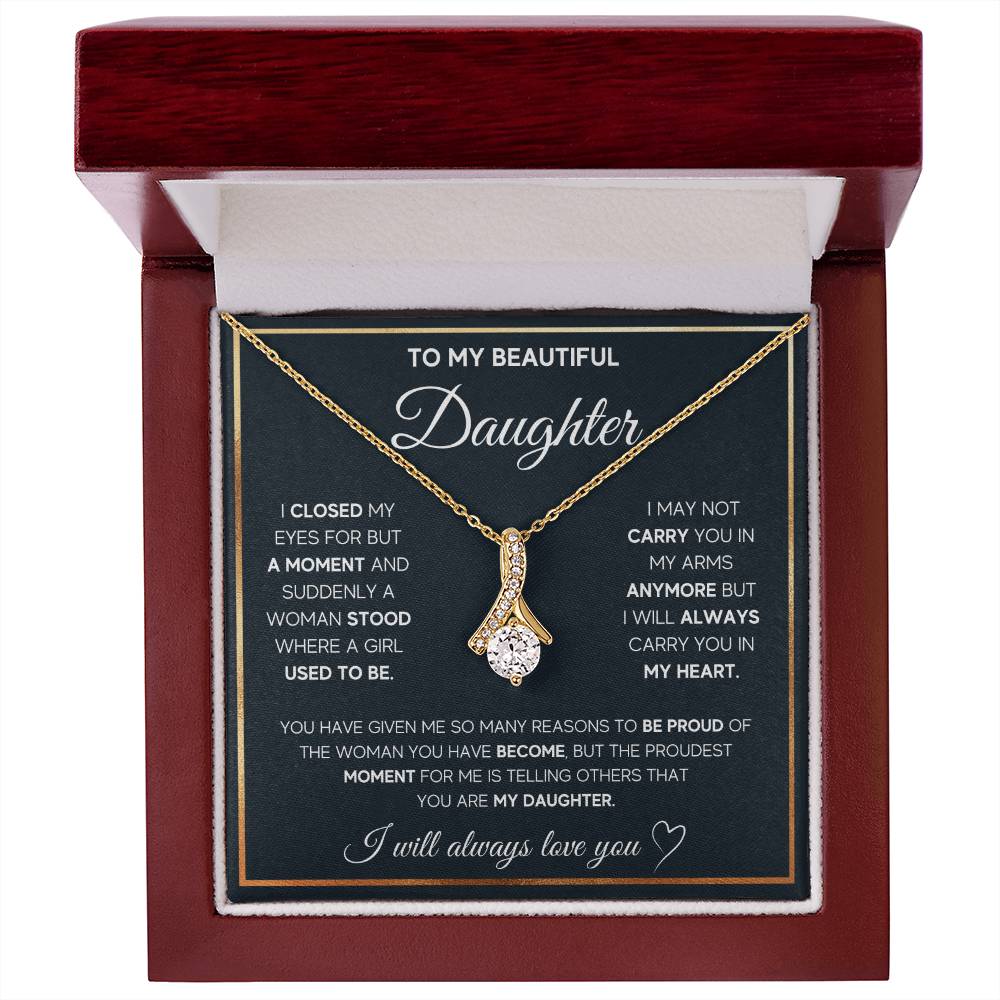 Gold-tone ribbon pendant necklace displayed on a daughter message card inside a mahogany box
