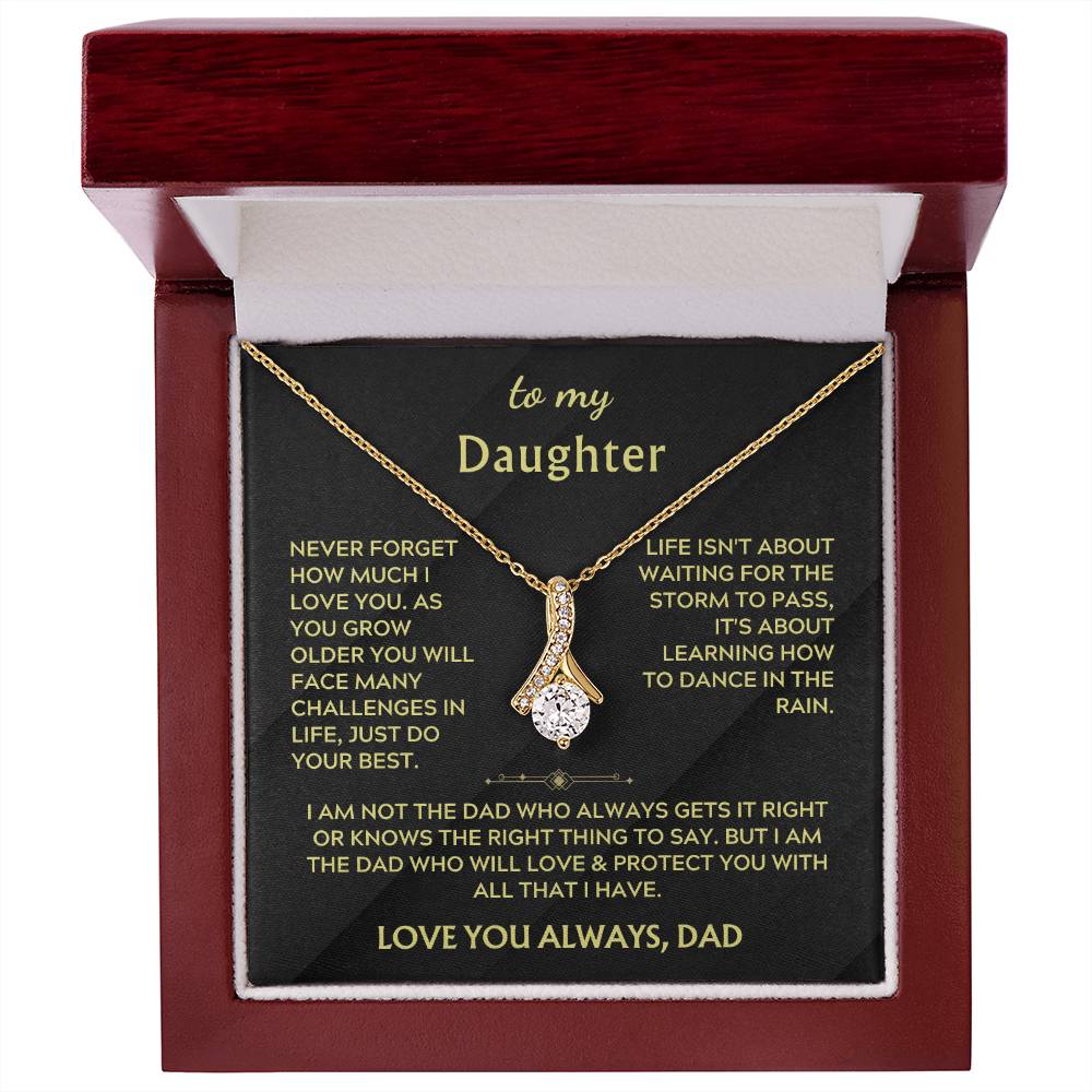Red presentation box displaying a gold ribbon pendant necklace and daughter message