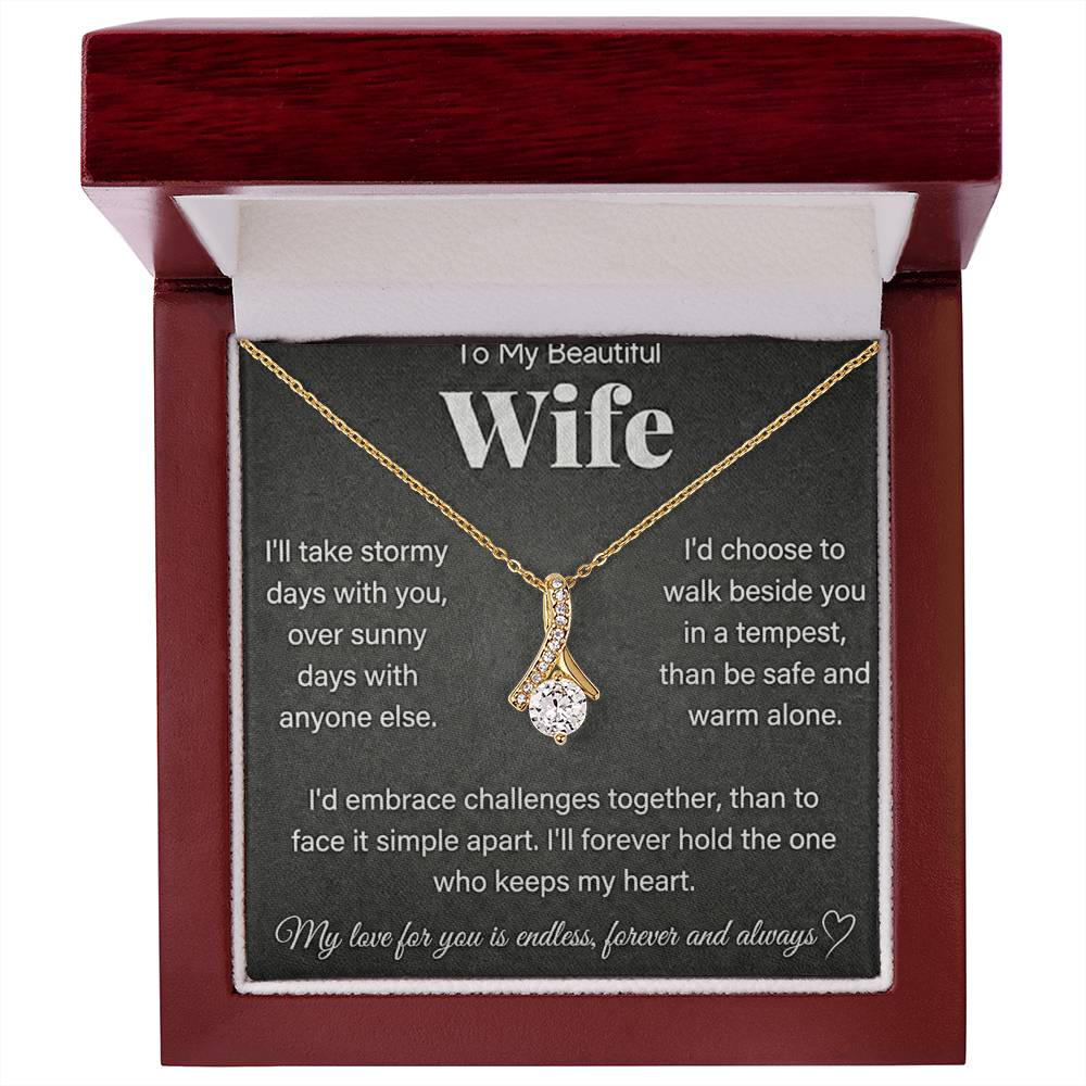 Red wooden presentation box with a gold-tone necklace and wife message card