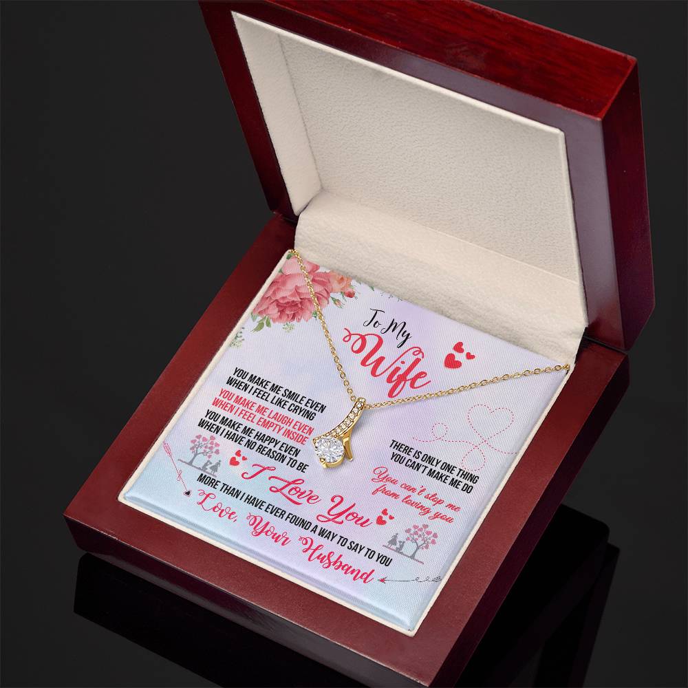 Angled open mahogany box showing the To My Wife necklace and printed message card
