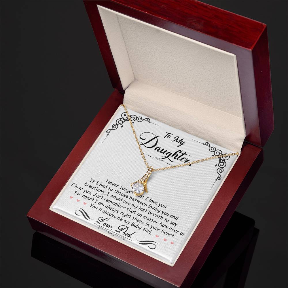 Gold pendant necklace and daughter message card shown in an open red gift box