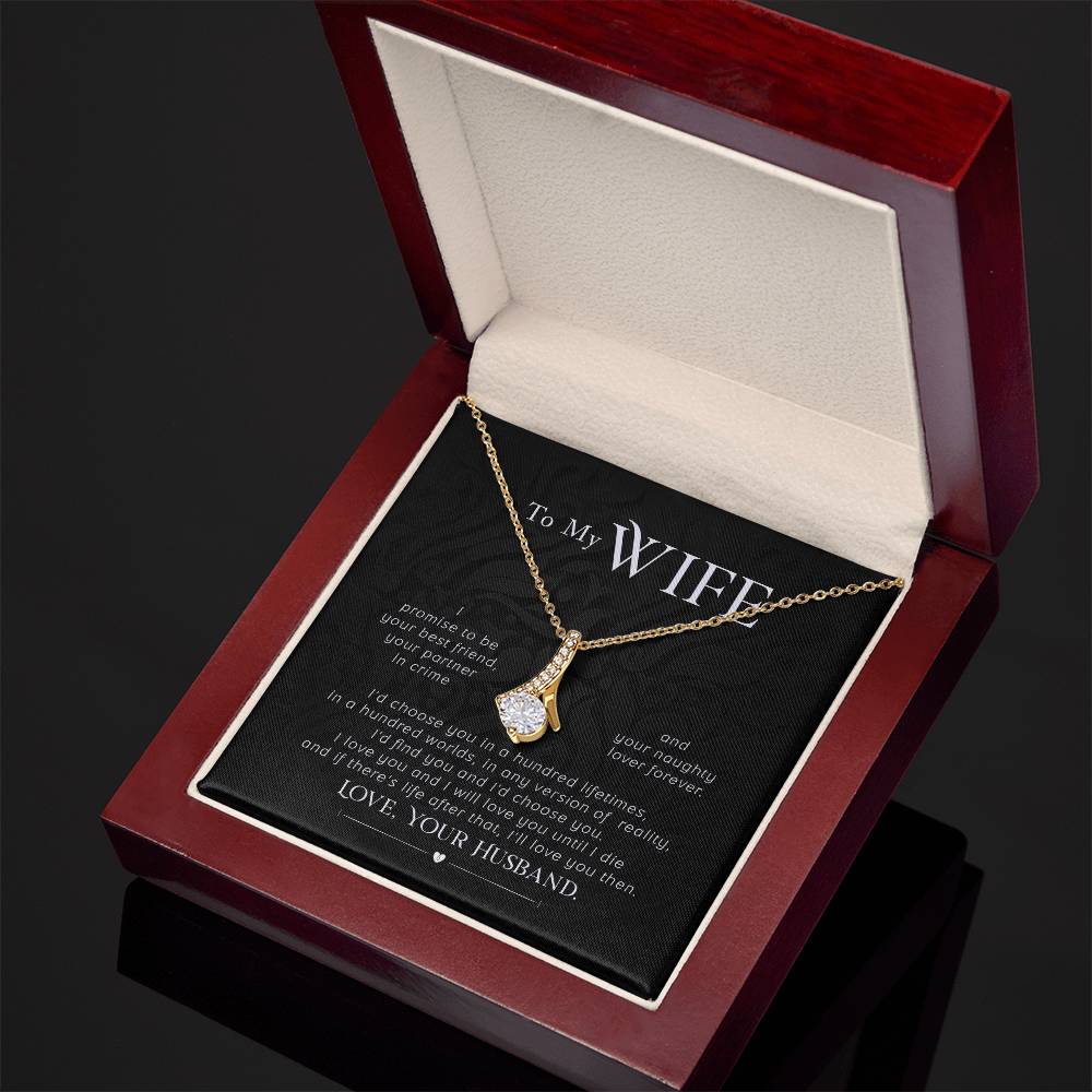 Angled view of the gold-tone necklace and wife message card inside a mahogany-style box.