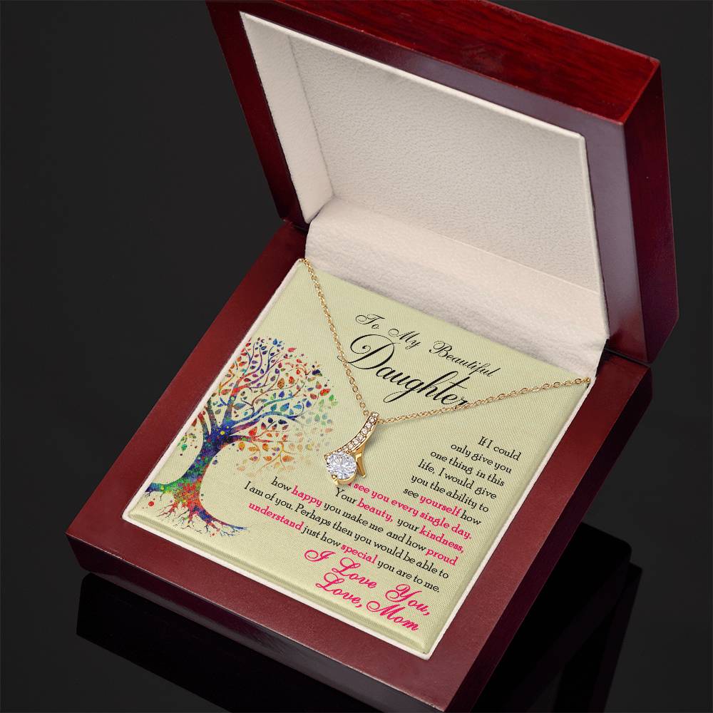 Angled view of a gold-tone necklace and daughter message card in an open mahogany-style box.