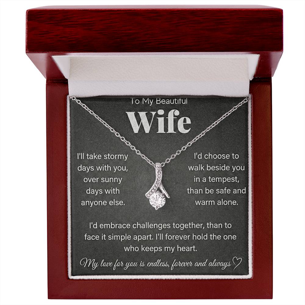 Red wooden presentation box with a silver-tone necklace and wife message card