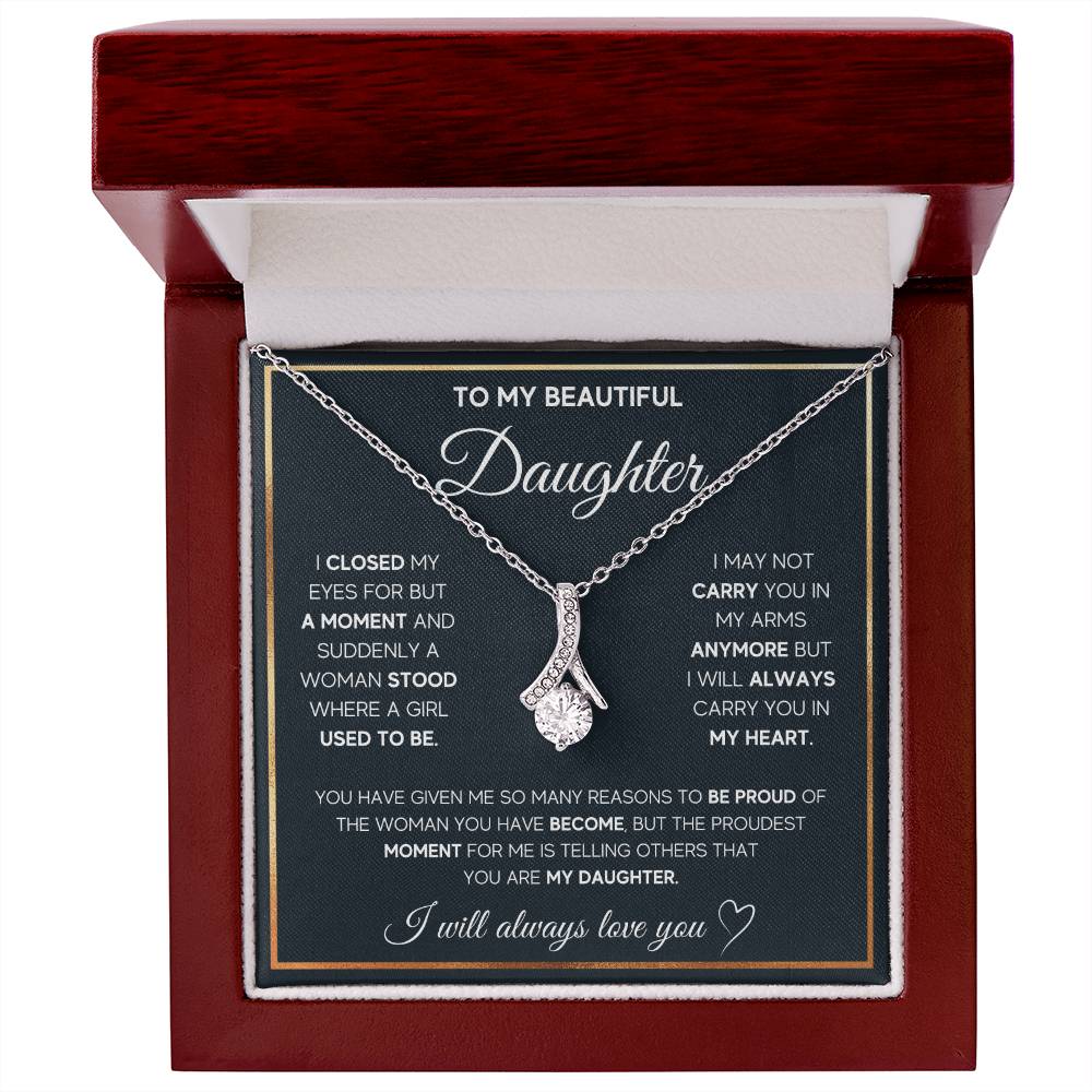 Silver ribbon pendant necklace displayed on a daughter message card inside a mahogany presentation box