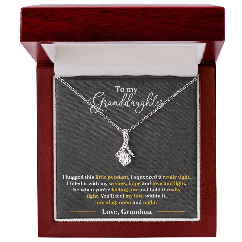 Silver pendant necklace and granddaughter message card in a mahogany box