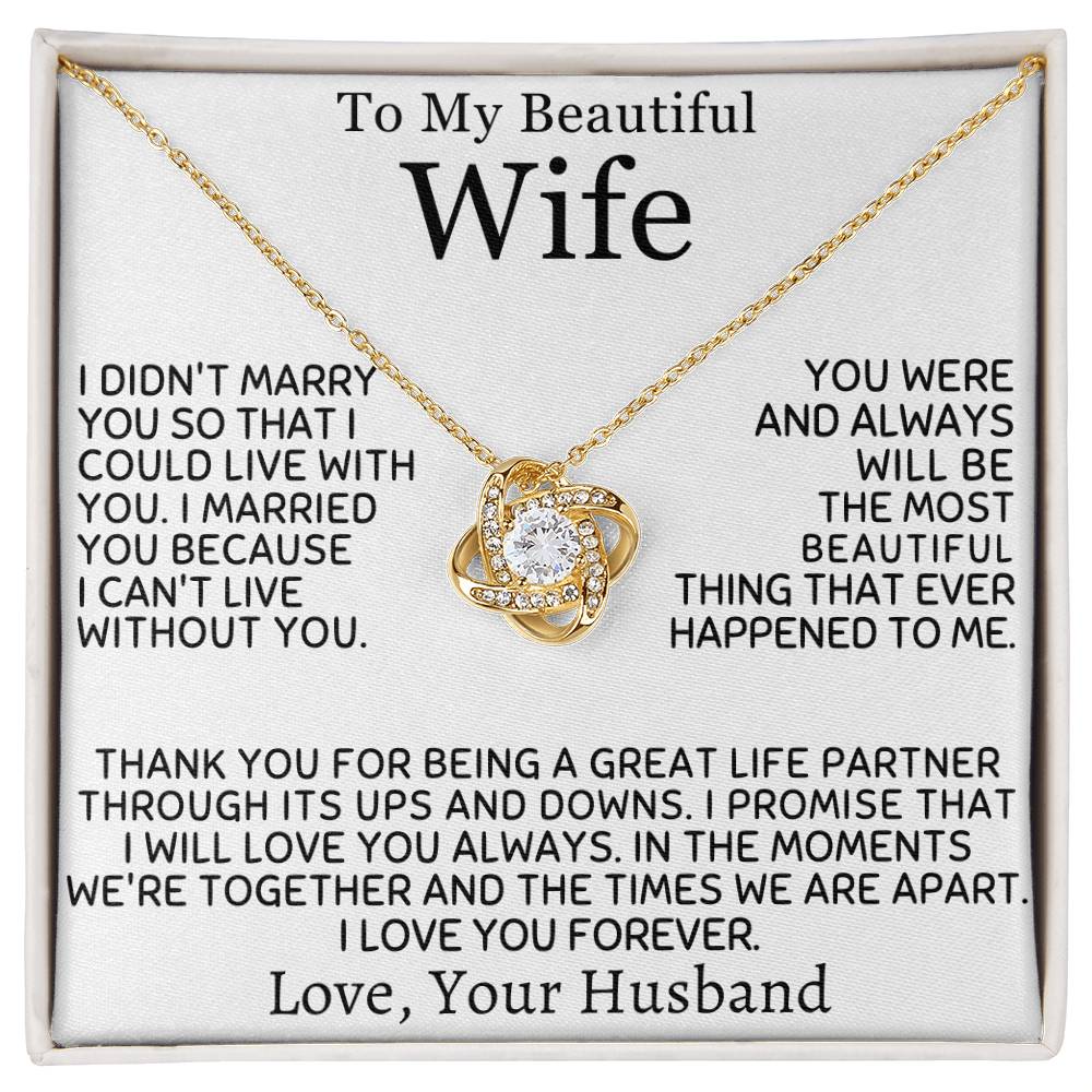 Gold Love Knot Necklace displayed across a printed message card for a wife