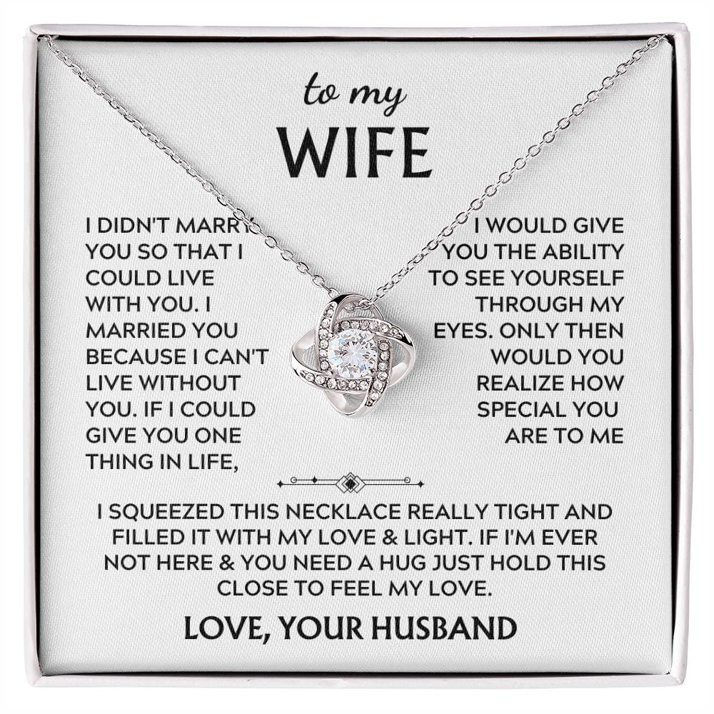 Silver Love Knot necklace displayed on a printed message card in a white presentation box