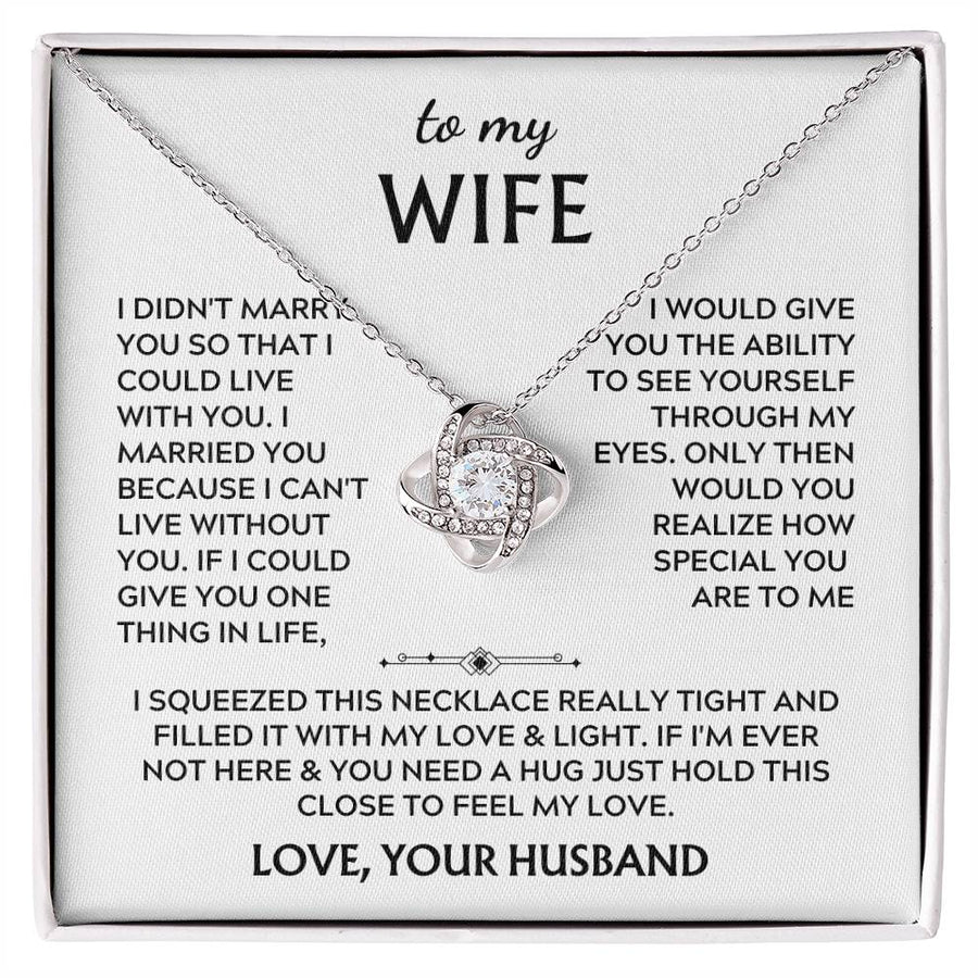 Silver Love Knot necklace displayed on a printed message card in a white presentation box