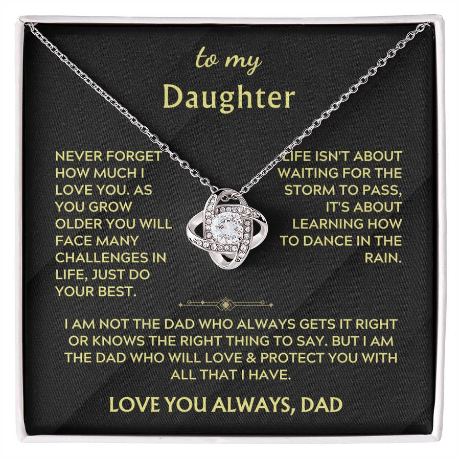 Silver-toned Love Knot necklace displayed on a black daughter message card in a white-edged box