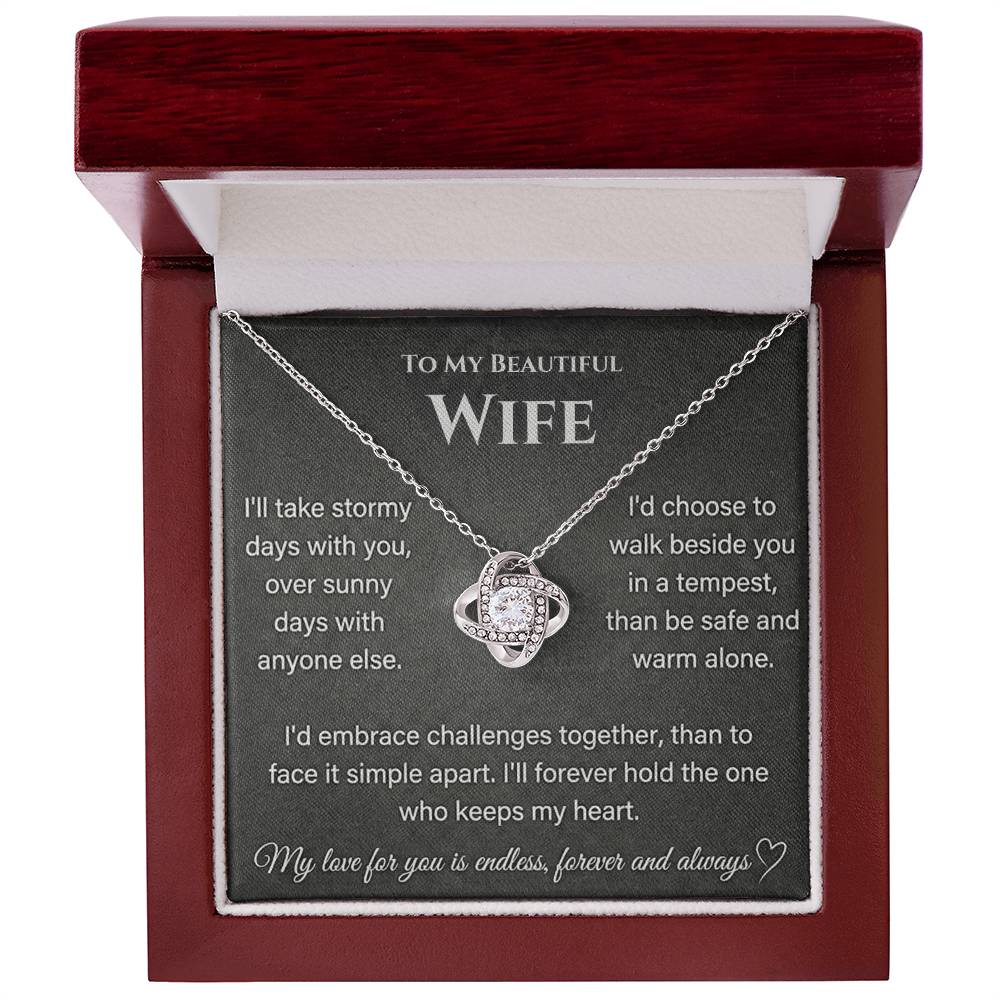 Silver Love Knot Necklace presented in an open mahogany-style box