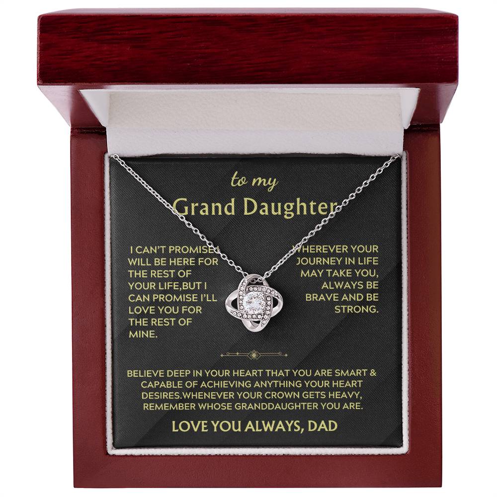 Silver Love Knot necklace and message card inside an open mahogany box