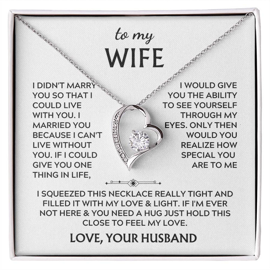 Silver heart pendant necklace rests on a printed “to my WIFE” message card in a white box.