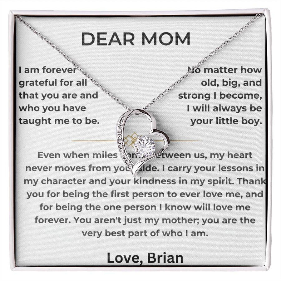 Silver heart pendant necklace displayed on a printed Dear Mom message card in a white box
