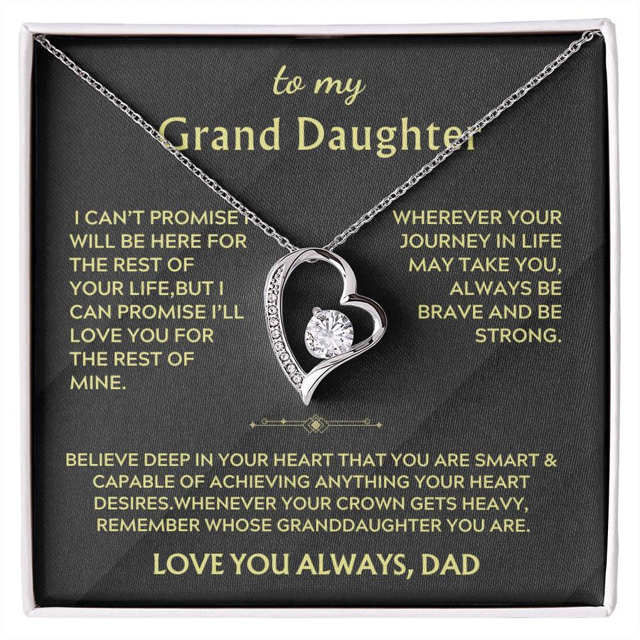 Silver heart-shaped necklace with a clear centre stone on a black Grand Daughter message card