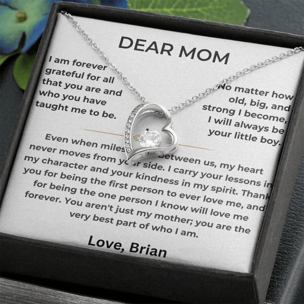 Silver heart necklace displayed on a Dear Mom card inside a black jewellery box