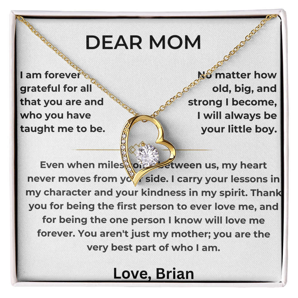 Gold heart pendant necklace shown on a printed Dear Mom message card