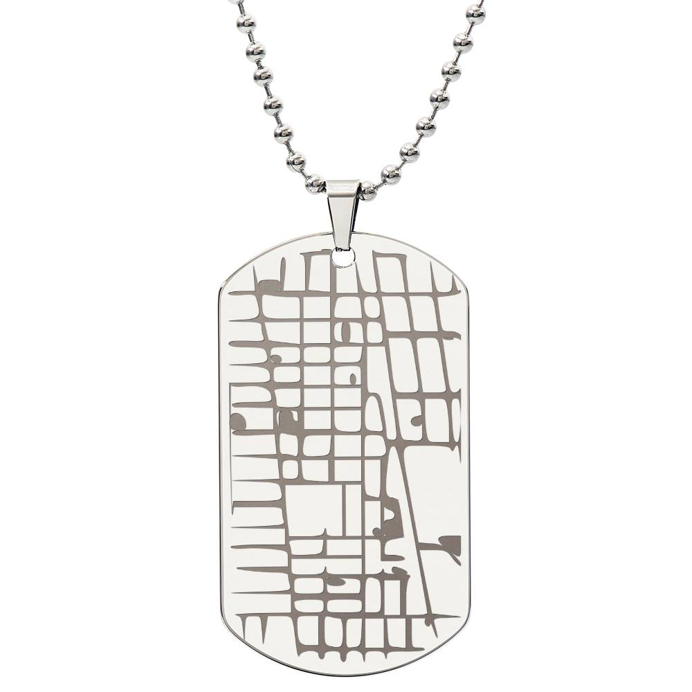 Silver-tone map dog tag necklace displayed against a plain white background